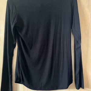 Black long sleeve top. New with tag still attached.